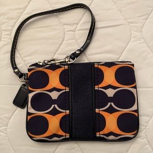 Navy and orange Coach wristlet